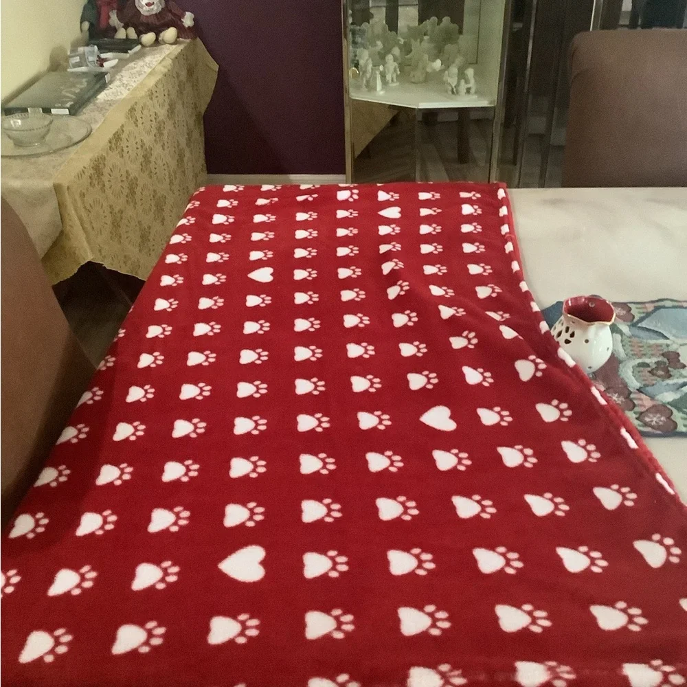 Doggie blanket a red & white with prints on it soft & cozy. 77”x50” clea…